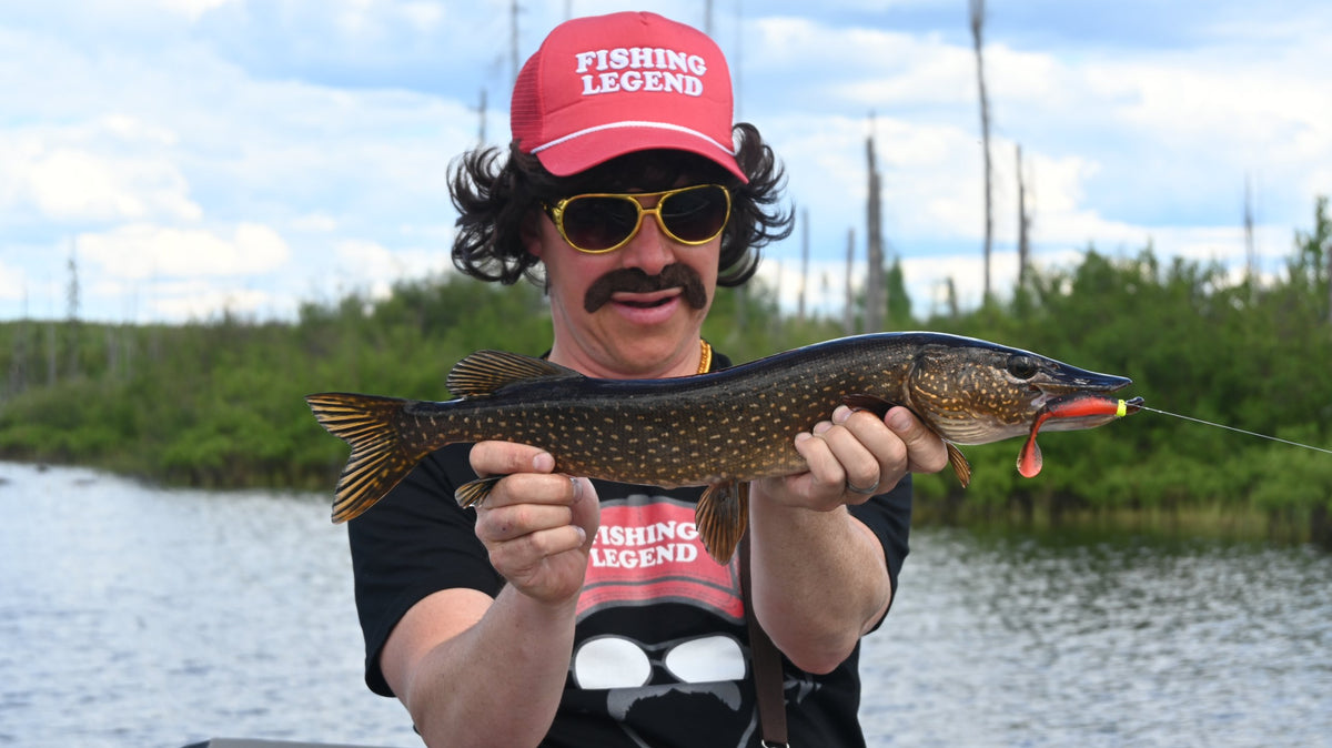 Marv holding a pike caught on a Lake Effect bait